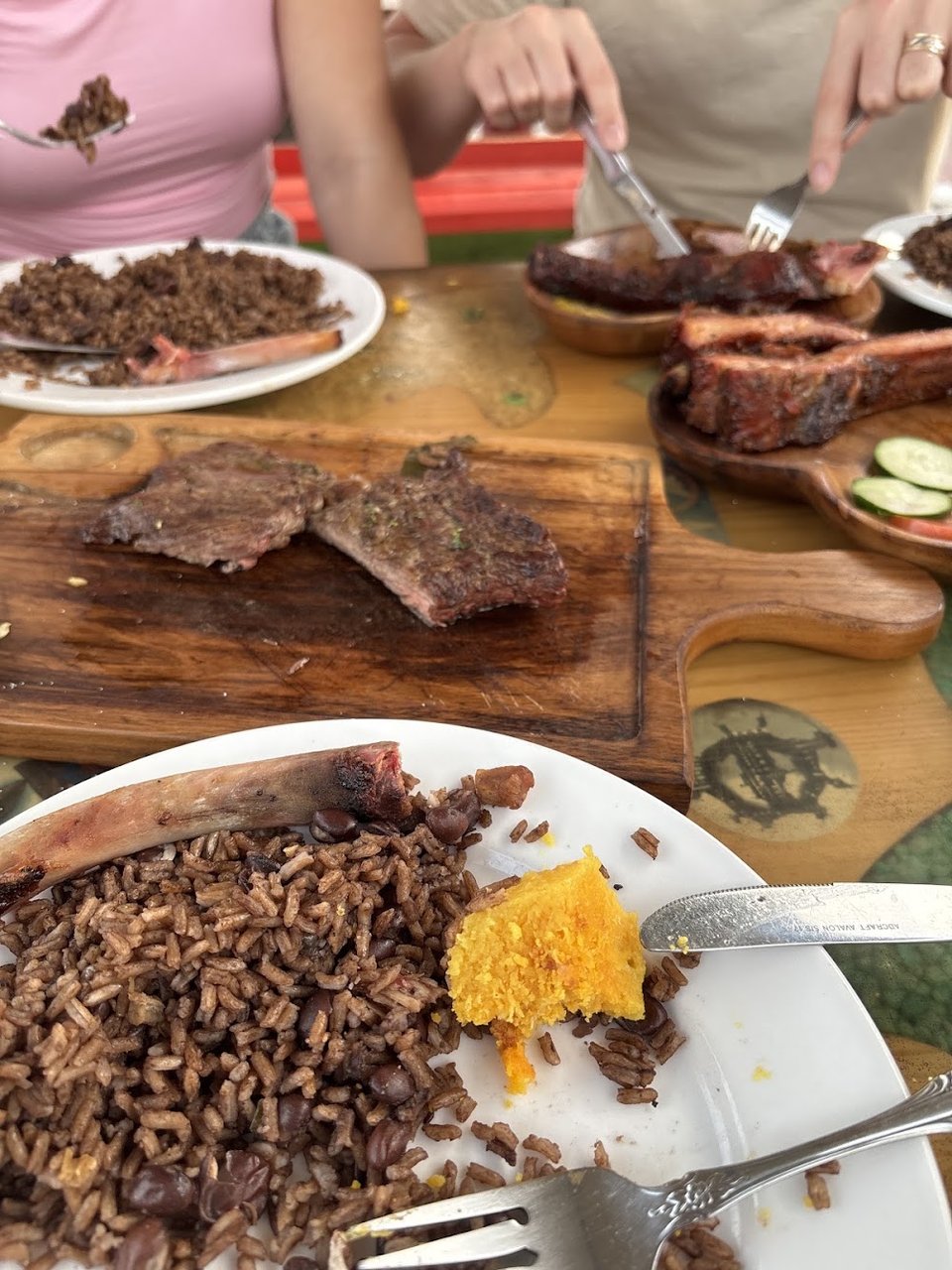 Restaurant menu highlighting smoked ribs and pork sandwich.
